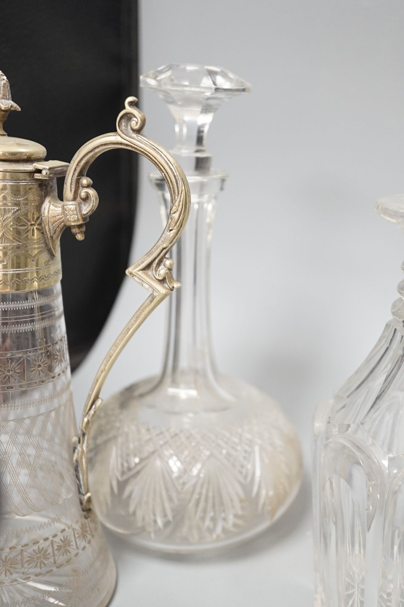 A Hukin and Heath claret jug and other decanters etc.